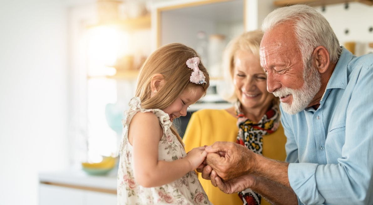 Child with two older adults