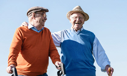 two older men smiling